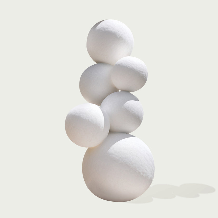 Stacked White Spheres Stainless Steel Sculpture on a white background