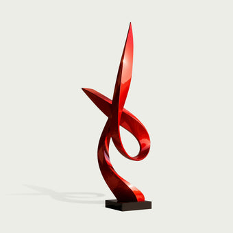 A glossy red abstract sculptural art piece mounted on a black rectangular base, shown against a light gray background.