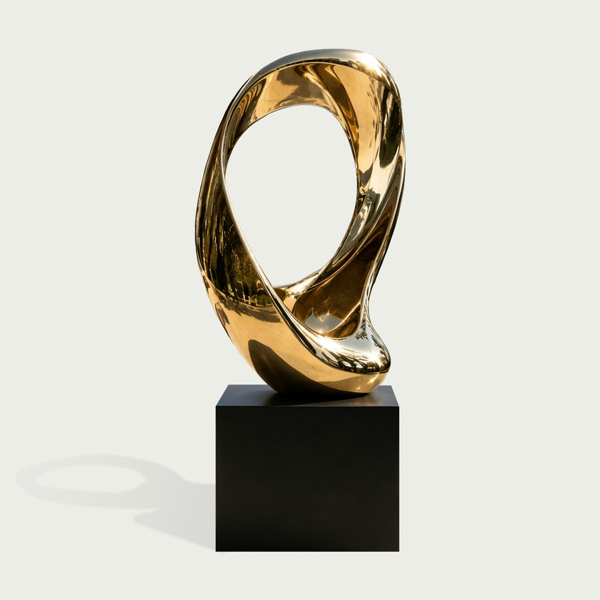 Twisted Golden Loop Gold Stainless Steel Mirror Polished Sculpture on a white background