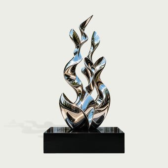 Contemporary abstract stainless steel sculpture featuring multiple tall, twisting ribbon-like forms that rise organically from an intertwined sculptural base. The elegant composition combines flowing curves, leaf-shaped pointed tips, and open spaces to create a dynamic sense of upward movement. Its highly reflective mirror-polished silver surface captures distorted reflections of trees, blue sky, and surrounding architecture. Displayed on a rectangular glossy black pedestal against a clean light background,